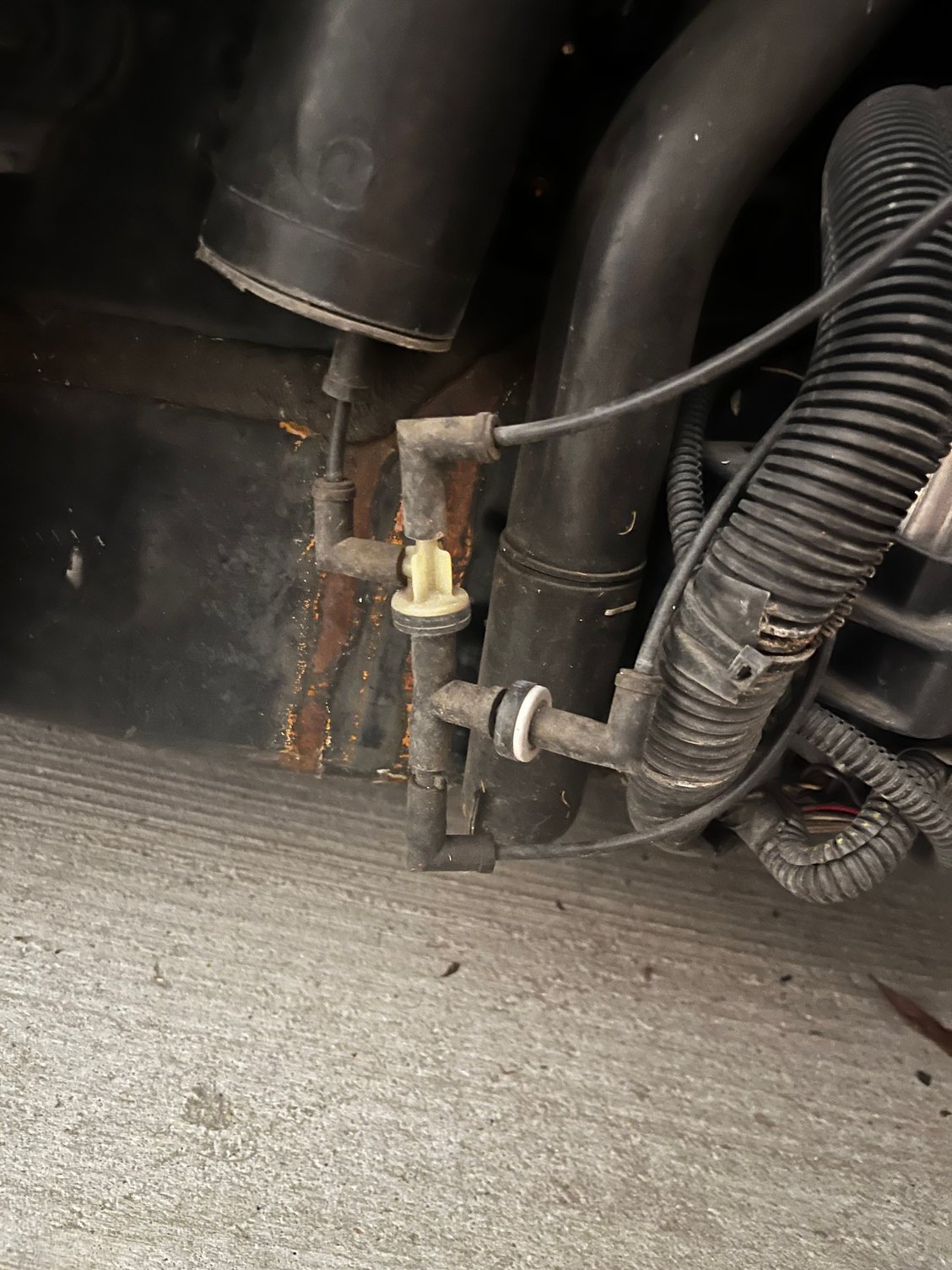 image of where the vacuum line connects to the vacuum reservoir tank