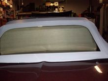 Outside view with white plastic and top up.