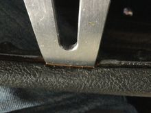 Brown looking stuff where metal spoke meets black vinyl/rubber