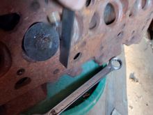 Verified the stop is below the head surface about 1/4" and would contact the piston. 