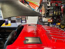 You can see the bracket on the hardtop, left front of photo