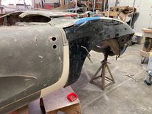this is how long they made the new part and we have to trim around the fuel door. on this side, fender was cut below the 1 1/2" tape from the peak 