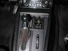 Center console with 3M carbon fiber material. Ebay shifter boot. Wanted to eliminate the plastic slide junk.