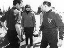 1966 Canadian Champion Laurie Craig & Stirling Moss discussing Craig's winning corvette before Stirling taking the car around the Westwood Race course.