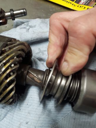Is this what you mean, 2 piece collar with a snap ring when you pull back the collar. That snap ring is going to be hard to get off pulling the collar against the spring.