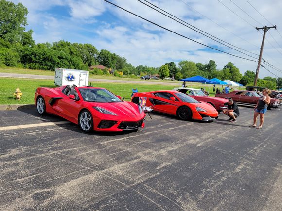Torch Red C8 next to a Red McLaren