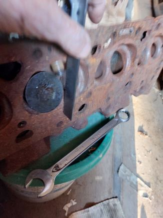 Verified the stop is below the head surface about 1/4" and would contact the piston. 