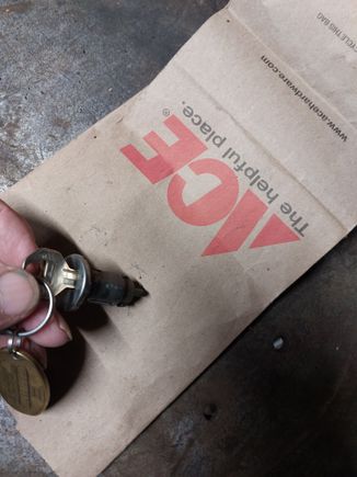 This is the key lock cylinder. Put the key in and turn it to the ACC position and you should feel the brass button with the paper clip in the small hole, then push the paper clip in and turn the key counterclockwise a little more and pull out on the lock cylinder. 