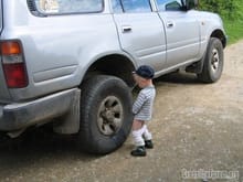 boy peeing in tire