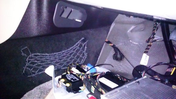 Passenger footwell panel removed (amplifier is on bottom right of photo)