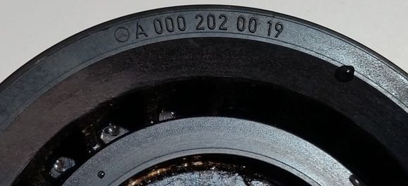 Because I'm a terribly busy man with many important things to do I cleaned the embedded dirt & grease out of the imprinted part number on the original equipment pulley so it's more legible.