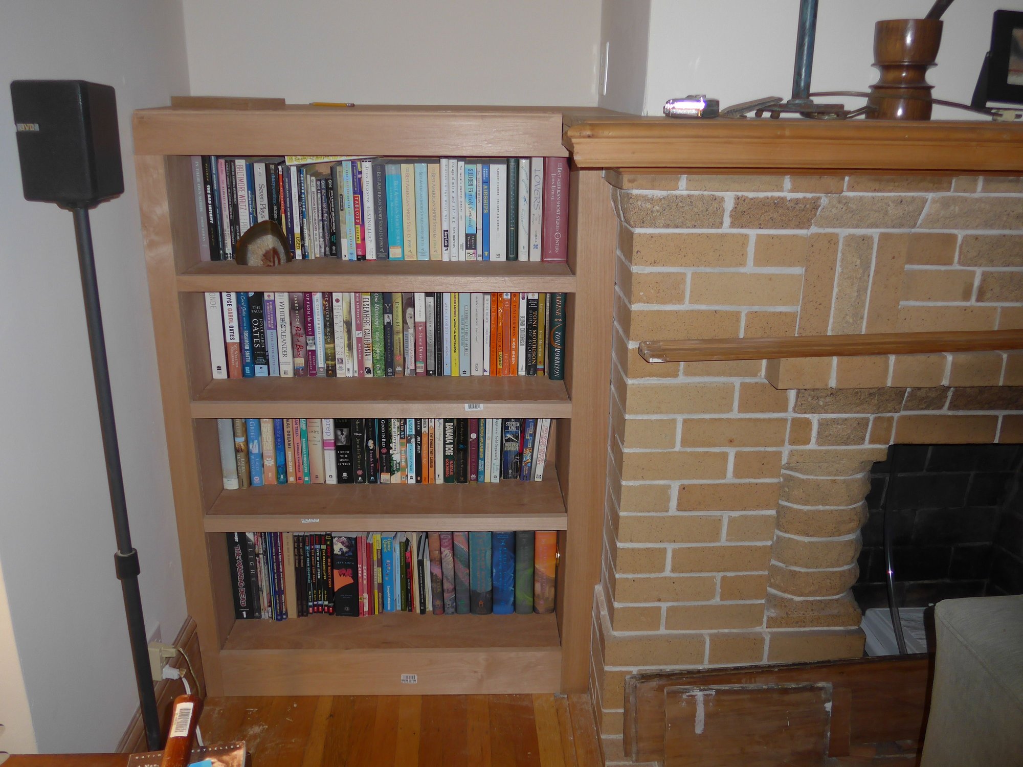 Best option to deal with this gap due to overhang for bookcase