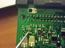 Diode 1(I think it's a diode) inline from pin 22.  Test good.  Both sides, continuity through.

You can count the leads, starting left to right on the bottom row, then move to the top row and count out to 22.