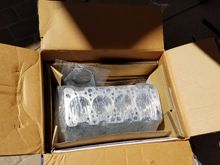 Cutting open the box for the first time. That loose part is my rear main seal housing.  They cleaned that up as well.