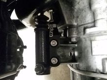 New slave cylinder with radium clutch fork stopper