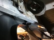 I need to build some sort of support bracket to take advantage of the factory push-pin location that holds the bottom up?  See the plastic hole?