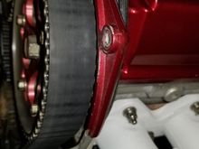 Wear on the belt from rubbing cam cover.