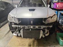 Mockup of stock front mount. Doesnt fit without cutting half of the bumper support bar away or hanging out the bottom of the bumper. didnt want that so went to an aftermarket IC core