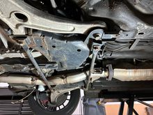 Two braces that prevent downpipe from dropping