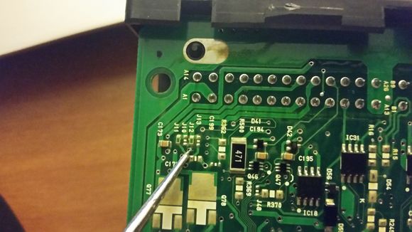 Diode 1(I think it's a diode) inline from pin 22.  Test good.  Both sides, continuity through.

You can count the leads, starting left to right on the bottom row, then move to the top row and count out to 22.