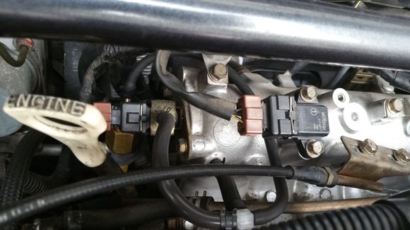 Boost sensor goes to right. Line wraps around and sensor is hiding behind for connector.