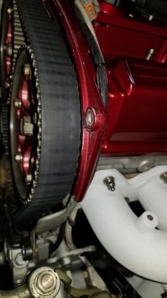 Wear on the belt from rubbing cam cover.