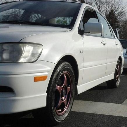 On my way back from my first meet with Ghost OZ. There were three dope white cars on a row. Mine, friends Miata, and a WRX that we met up with. I cut them out because this shows my rims perfectly, it became my main picture for her.