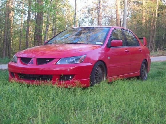 2004 Ralli-Art, 2.4 Mivec, Lowered 2" with a correct stance, 18" wheels, New kenwood HD stereo ipod connection, EVO headlights with HIDs and Halos, EVO rear tail lights with black housing, EVO wing with carbon fiber inner, CARBON fiber EVO RS diffuser