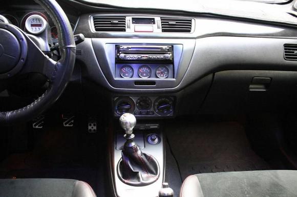 Modified HVAC relocation, Doubble din, JDM red stiched shift boot.