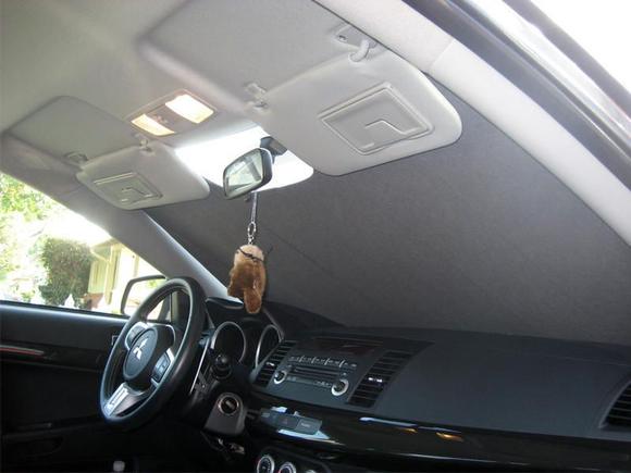 Interior view when Covercraft sun shade is up. I'm so amazed with the fit and quality, it doesn't bend and isn't flimsy like regular shades.