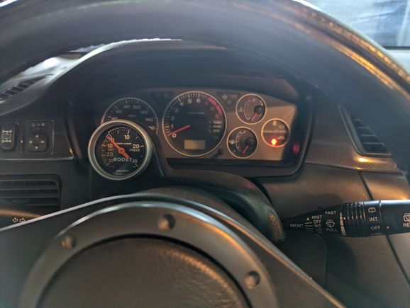Autometer analog boost gauge.