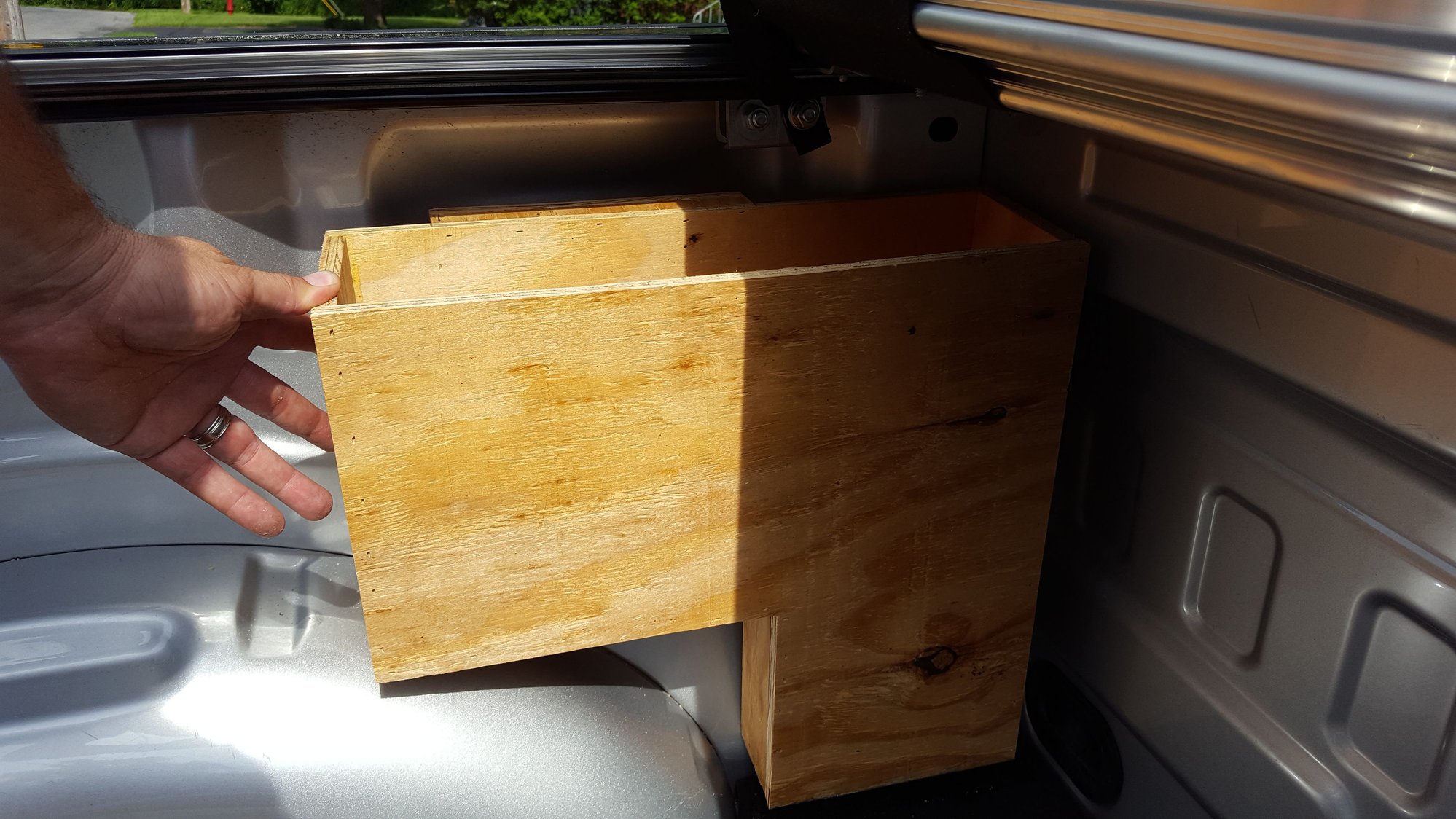 Storage solution for in front of the wheel well in bed Ford F150