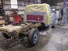 Covering cab to prep for undercarriage washing/coating.