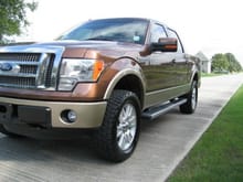 These Nitto's are 33.2x12.6 and the maximum width for these OEM wheels. This was my '11 Lariat 4x4 with a 2 inch level.