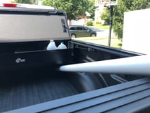 Install as far forward as possible.  Tonneau covers 3" of the Bakbox.  This makes larger bags and boxes not fit that would otherwise normally fit. 4" pipe fits to front of bed, so loading studs or plywood with tailgate closed won't be a problem.