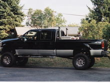 Uncles 03 F-350 with Stacks and a 10&quot; super lift with Mickey Thompson 37/13.5R20's