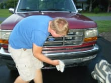 My son putting on the new front bumper we found on Craigslist.  The original was rather...scary.