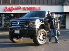 I don't exactly, but it is an RBP truck and I found this image on their site, which I am pretty sure is the same truck. Based on this pic, I am guessing 35's on 20&quot; rims with a 4-6in lift.