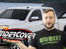 UnderCover's Classic Truck Bed Lid shows off how she tilts open, while Kyle pretends to juggle UnderCover and Truck Hero logos.