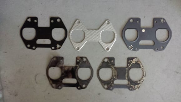 The two on the bottom are the old gaskets.  Top right to left (Dorman, Felpro, FoMoCo).  I used the Felpro.