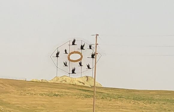 There is this two lane state hwy that has a bunch of metal sculptures constructed by one farmer.

This one is "Geese in flight"