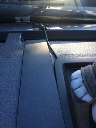 A wider view of the tray.  A small piece of gorllia tape hold the cord down at the defroster vent.
The plastic strip is the Proclip mount for my Ham radio.