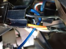 This blue eire then goes into this connector which is plugged into this "thing".
