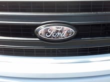 Painted ford emblem black and added a decal overlay.