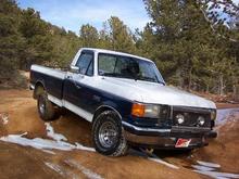 Exploring old mining roads in Colorado.  It was a 'Truck'.  Nothing fancy, nothing automatic, leave it stock, let it live.  XL pkg, 5.0 Ltr w/ shorty headers, Elct Fans, K&amp;N.  4spd manual.  No lift - just removed the rear sway-bar for axle artcltn.  Open Diffs, skid plates and 31x10.5 R15 Tires.