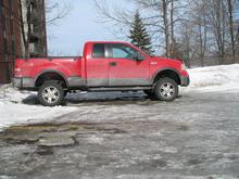 With stock tires and rims