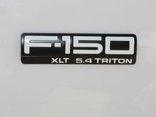 Black badge with white inlay