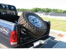 Spare Tire carrier. Yes, it is a Full Size 38" tire.