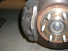 Grind - you can still see some of the casting seam that was ground off.  I smoothed it out top to bottom then painted.  The new rims proudly showed all the hub rust - had to fix.