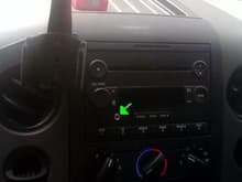 put in a proclip for the iPhone and an upgraded radio that has a CD player and an added aux port (green arrow)